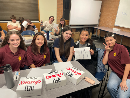 Students receive Banner Health swag at GIS at ASU meeting