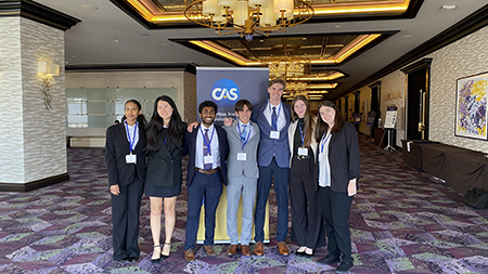 GIS at ASU officers standing in front of CAS banner in Austin, TX